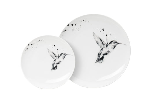 Dinnerware set of 4, 6, 8 containing one white porcelain dinner plate, and one salad plate each with single hummingbird in flight illustration and black ink splatter dishwasher and microwave safe product photos on white background